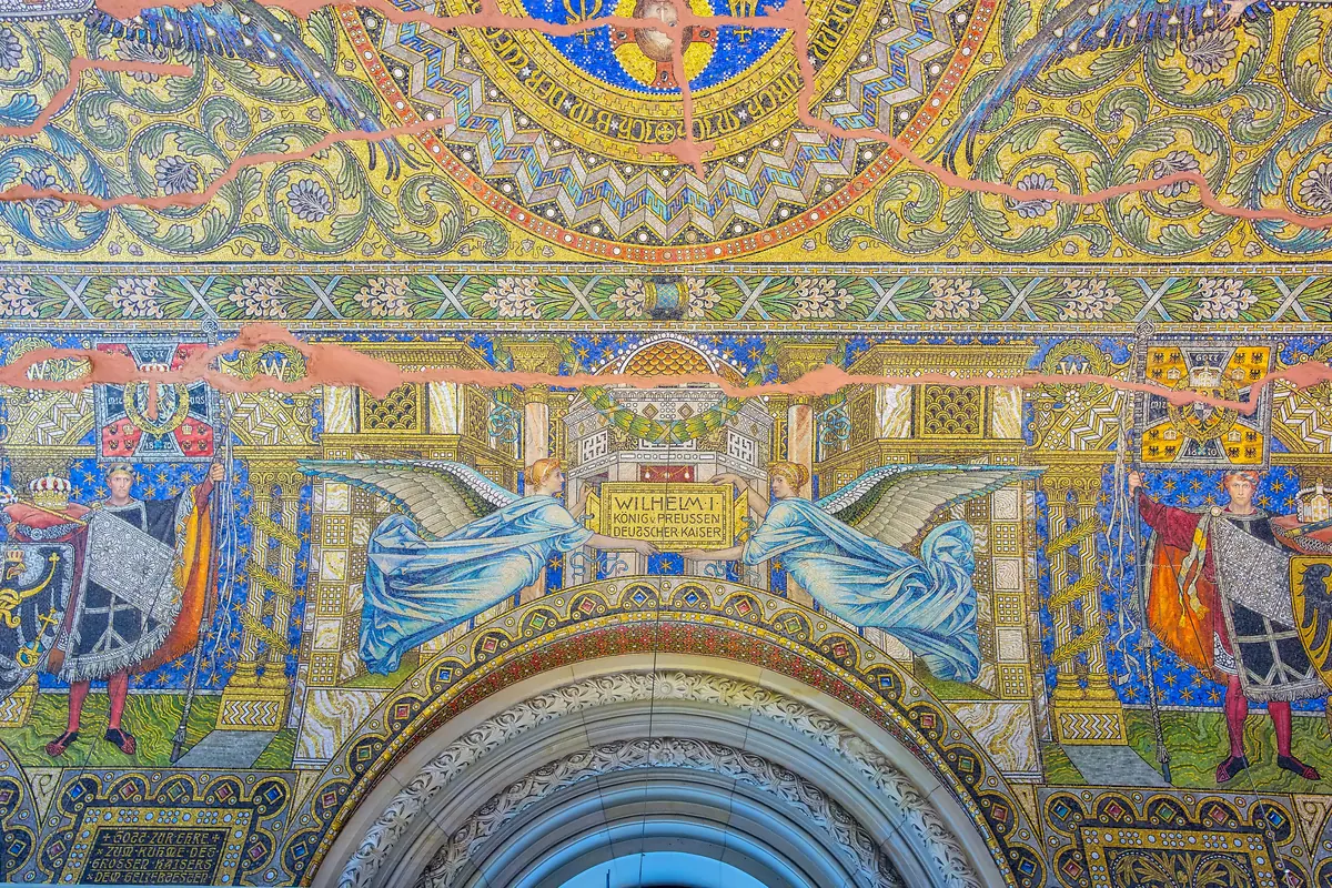 The vaulted mosaic ceiling and arched wall above the entrance hall in the old tower of the Memorial Church, in gold, blue and green tesserae